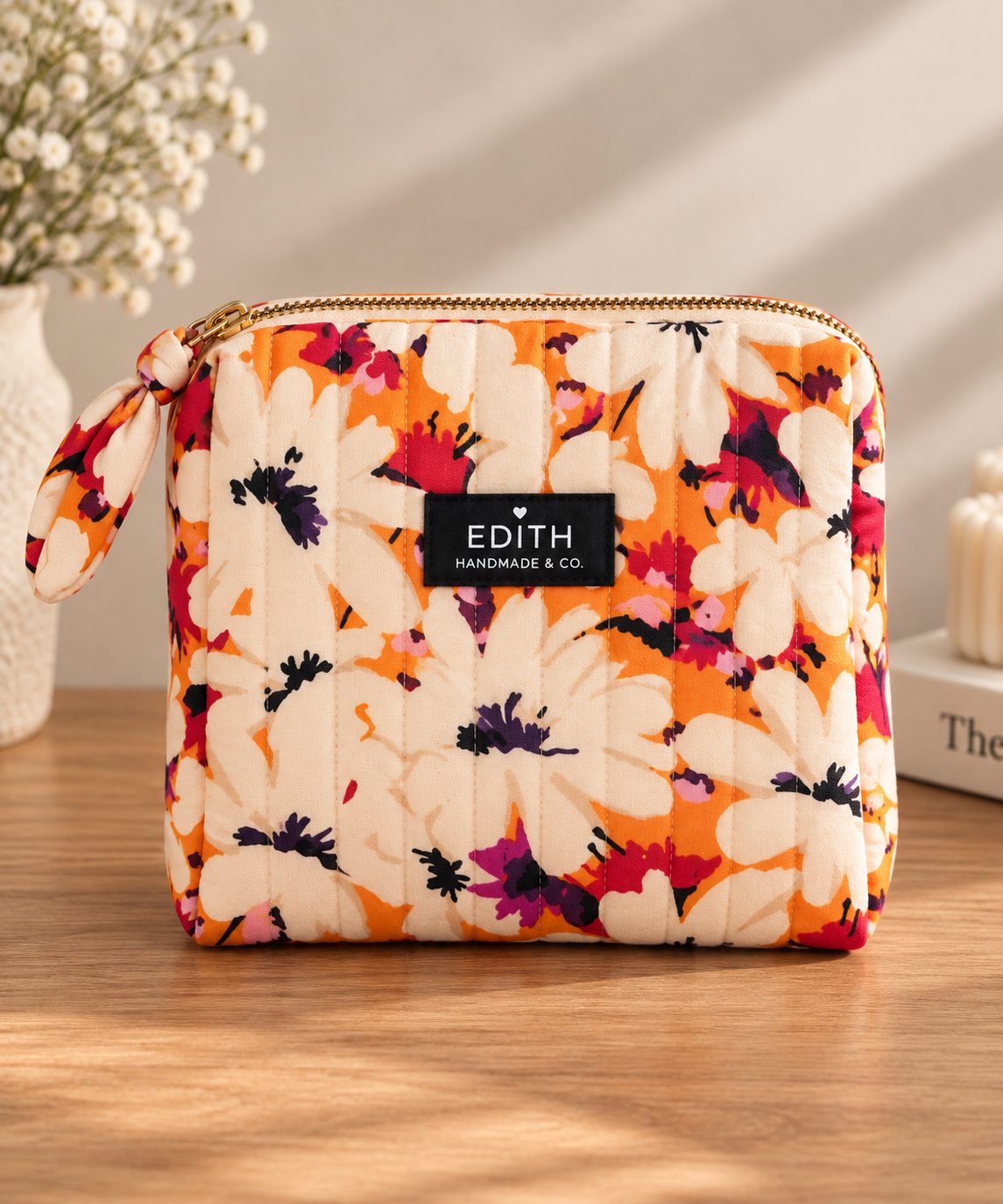 Handmade Tangerine Daisies quilted zip pouch – orange daisy floral print with fabric knot zipper pull, November limited edition